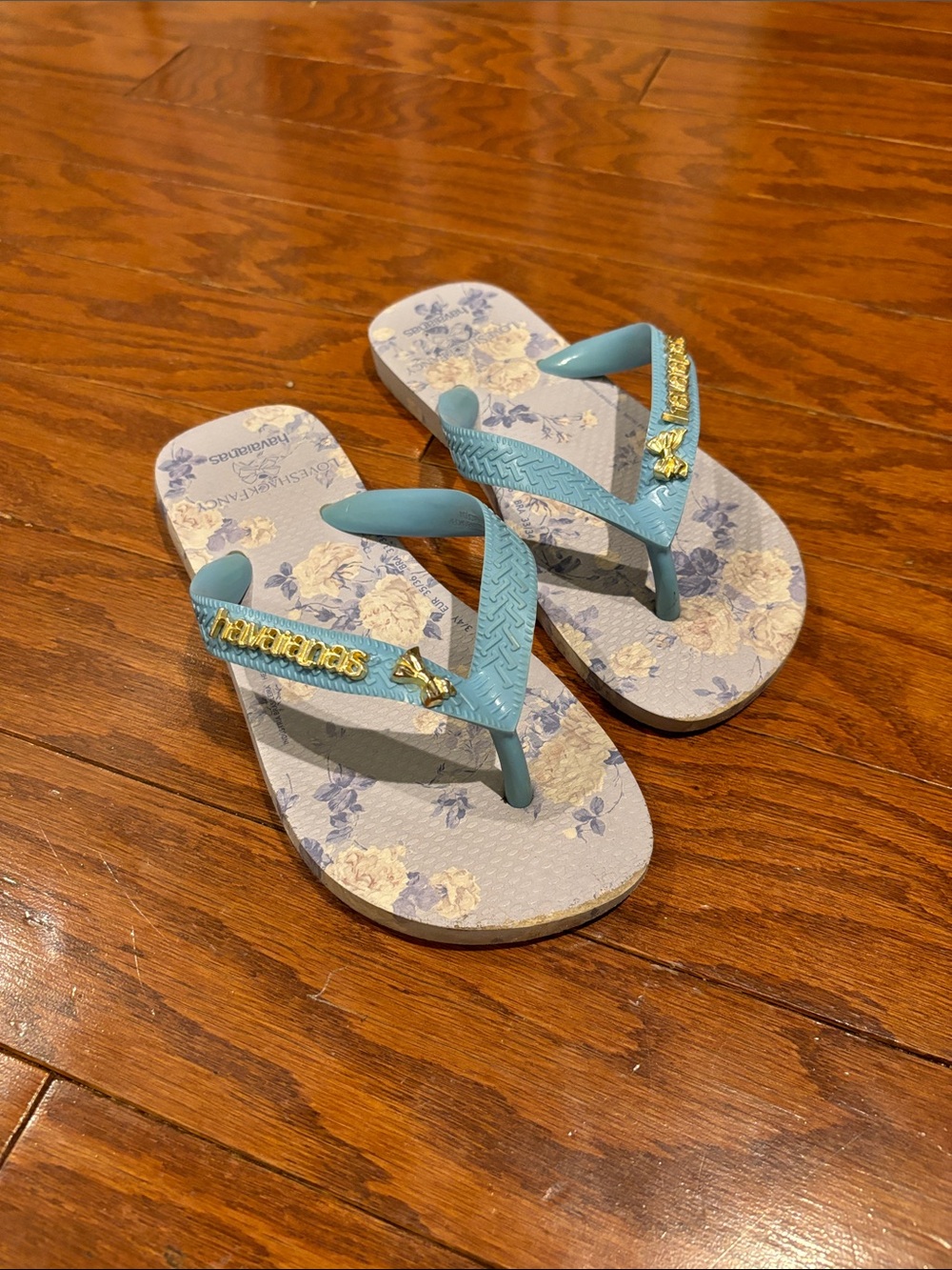 Havaianas Kids Floral Flip Flops in Light Blue and Gold